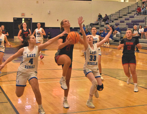 Fannin County’s Braylee Davenport (#4) and Kylie Breeden (#33) defend against Copper Basin’s Alexis Hyatt in the Piedmont Holiday Classic tournament Saturday.