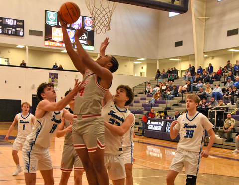Copper Basin’s Darrius Harris works his way between Fannin County defenders for a two-point attempt.