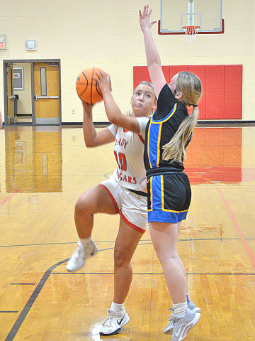 Copper Basin Lady Cougar Kendra Deal (#10) outmaneuvers her Lookout Valley opponent for the successful jumper. The game was in school February 17.