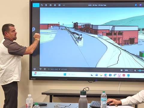 Fannin County School System Chief Operations Officer Darren Danner discusses a rendering of the new CTAE facility during a school board workshop last week.