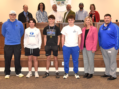 Fannin County Middle School wrestlers were honored for their tournament accomplishments by the Fannin County Board of Education. Shown during the ceremony at the February 12 school board meeting are, from left, front, Coach Josh Snider, Grayson Woody, Clay Maddox, Luke Snider, FCMS Principal Dr. Arpil Hodges and FCMS Assistant Principal Chuck Patterson; and back, board members Bobby Bearden, Ashley H. Weeks, Adam Born, Mike Cole, Robert Patterson, and School Superintendent Shannon Dillard.