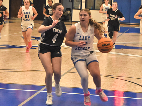 RIGHT: Izzie Jabaley, shown in action earlier this season, iced the win over region rival Christian Heritage with four straight free throws Friday night. News Observer Photo/ Glenn Harbison