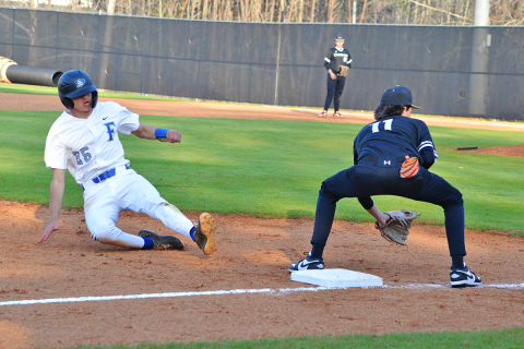 News Observer Photo/Jason Queen Fannin County’s Rylin Davis slides into third base in the Rebels’ 11-1 win over Coosa Thursday, March 19.