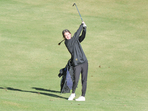 Olivia Ford hits a fairway shot.