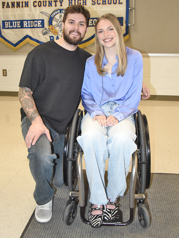 Emma Benoit is shown with her husband, Evan, before telling students about the devastating effects of suicide.