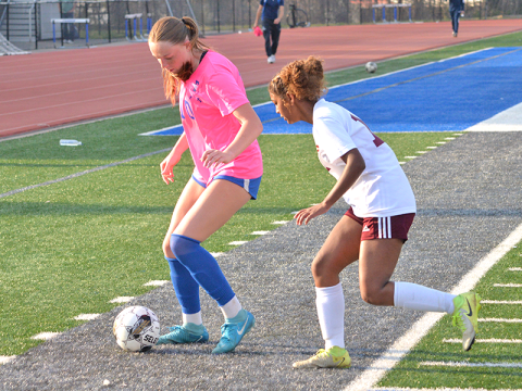 Fannin County Lady Rebel Marinn Denton (10) battles for the ball with a recent opponent at home. 