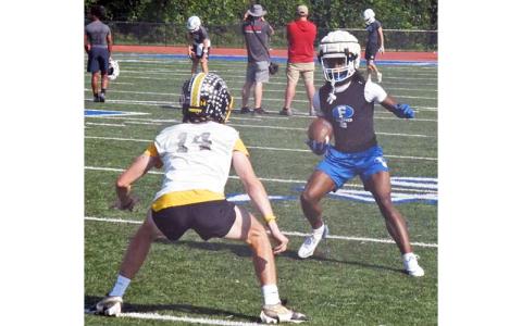 News Observer photo/Jason Queen - Fannin County Rebel Ryan Preston (right) attempts to get around his Murphy opponent in 7-on-7 action at the school's stadium June 11.