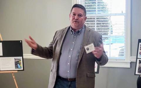 News Observer photo/Mollie Morrow  - Rich Chism of Heron Hotels tells of plans for a 160-room hotel in Blue Ridge during an open house at United Community Bank in April.