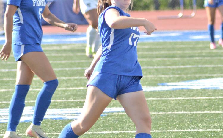 Fannin Lady Rebel Lily Williams (17) goes for the kick while Natalie Middleton (5) looks on. 
