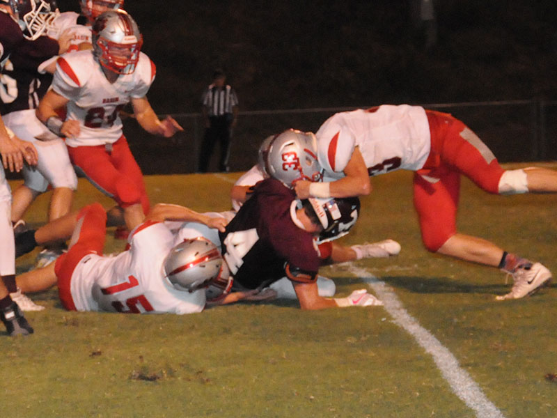 Copper Basin Cougar Chase Mickens (24) rushes to help Joe Boggs (15) and Timothy Fair (33) tackle a Tellico player during the Cougars win Friday, September 13.