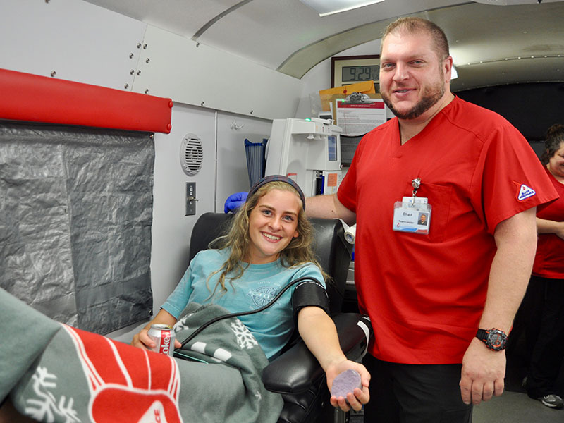 Fannin County High School student Teagan Cioffi relaxes after donating blood at Blood Assurance’s blood drive on the school’s campus Friday, September 20. She is shown with Donor Care Specialist Chad Taylor. The blood drive was sponsored by the high school.