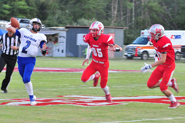Copper Basin Cougars Cody Montgomery (85) and Larry Dye (52) bring pressure to the Sale Creek quarterback during Copper Basin’s game against the Panthers Friday, September 6.