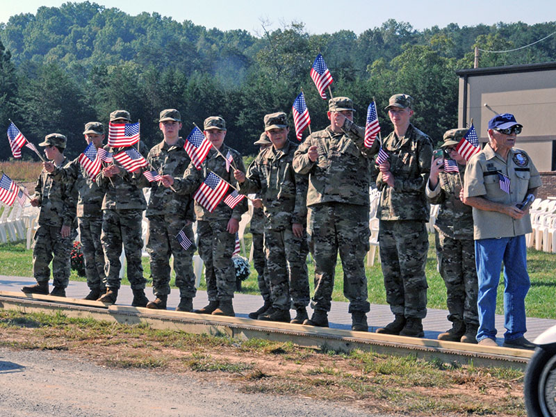 Members of the Junior ROTC program at Mountain Area Christian Academy were among the crowd welcoming The Vietnam Traveling Memorial Wall to Blue Ridge Thursday. Shown are, from left, Chase Roll, Wesley Tanner, Reagan Hooper, Ayden Gunsallus, Dawson Long, Willie Nickerson, Vance Coffey, Elijah Carroll, Ben Bargeron and Elizabeth Lee. The group also helped construct the Wall, which stood beside the Blue Ridge United Methodist Church from Thursday through Monday.