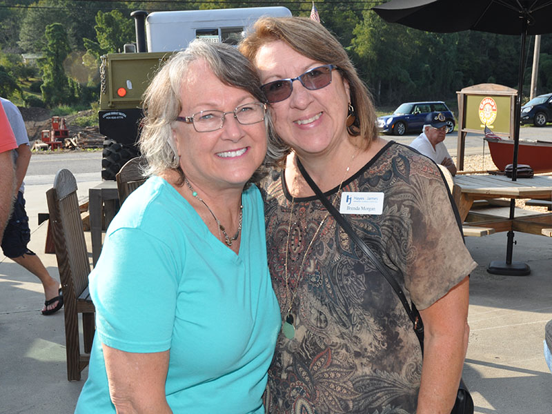 Debbie Monck and Brenda Morgan catch up during the Chamber of Commerce’s Business After Hours and Blues & BBQ Festival kickoff party at Grumpy Old Men Brewing.