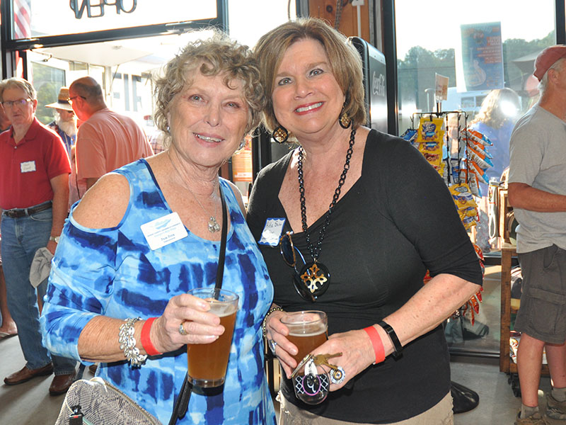 Pam Fink and Rita Suiter enjoy the recent Blues & BBQ Festival kickoff party and chamber networking event at Grumpy Old Men Brewing, September 19.