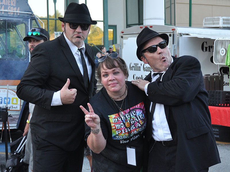 The Blues Brothers crashed the Blue Ridge Blues & BBQ Festival, September 21. Shown carousing with them is Brannan Mathis of Mystic Mountain Pizza.