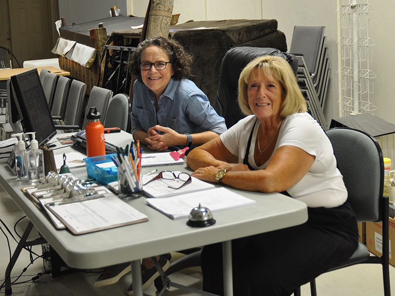 Fannin County Family Connection food pantry volunteers Kathy Corey, left, and Denise Hyatt help folks from the community who need food to nurish their families. October 1 was the first day the food pantry was open at the new location at 501 Industrial Park Rd.