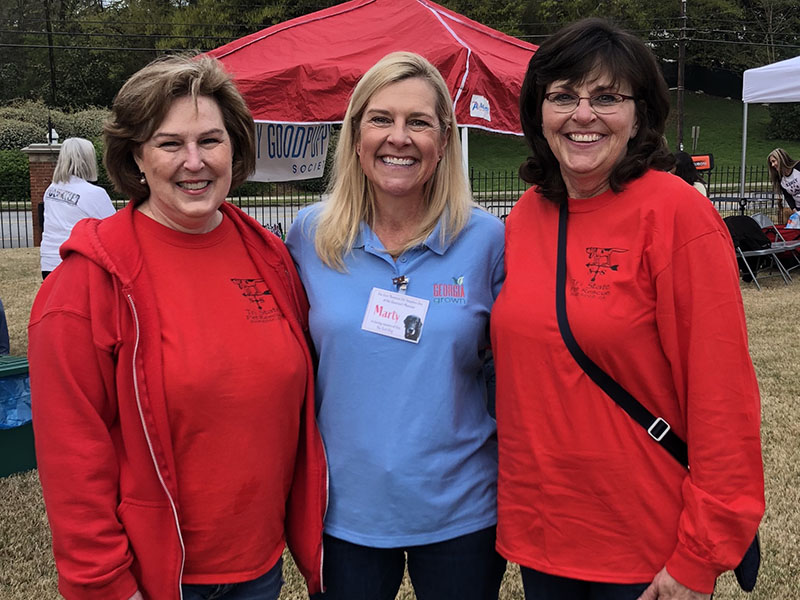 Georgia’s First Lady Marty Kemp, center, organized a pet adoption event at the Governor’s Mansion this past March. Tri State Pet Rescue volunteers Victoria McLaughlin, left, and Jan Eaton stand with her in support.