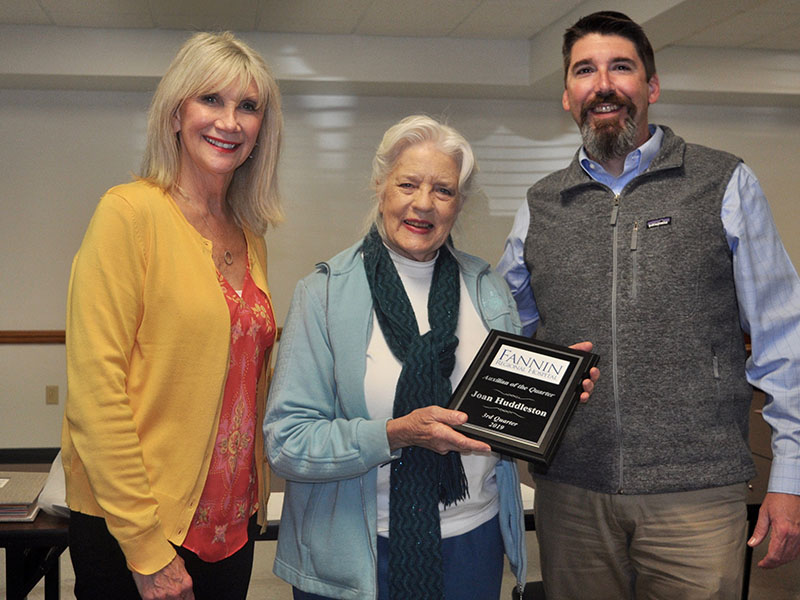 Fannin Regional Hospital Auxiliary member Joan Huddleston, middle, was recognized as the “Auxilian of the Quarter” during the auxiliary’s quarterly meeting Thursday, October 17. She is shown Fannin Regional Interim CEO Jason Jones and Director of Volunteer Services Susan Kiker.