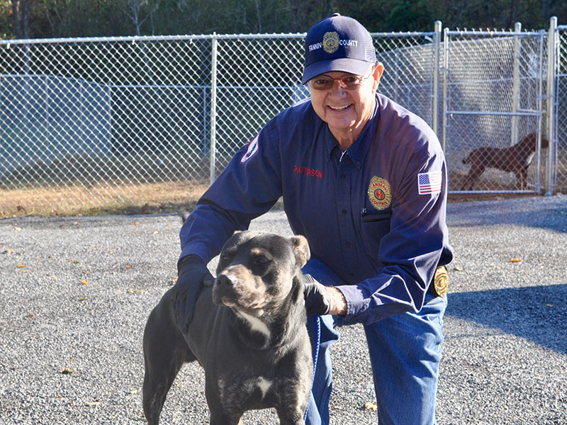 Animal Control Officer Pat Patterson poses with a male Lab mix named “Rowdy” who was found on Madola Road. He is staying at Fannin County Animal Control until reclaimed or adopted. This sweet boy has a beautiful black, tan and white coat. View this handsome guy under Animal Control number 314-19.