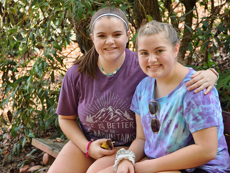 Gracey Green, left, and Hollyanna Green sat on a bench next to the Toccoa River as they waited for the race to begin at the Boys & Girls Clubs of North Georgia’s annual Great 515 Duck Derby.