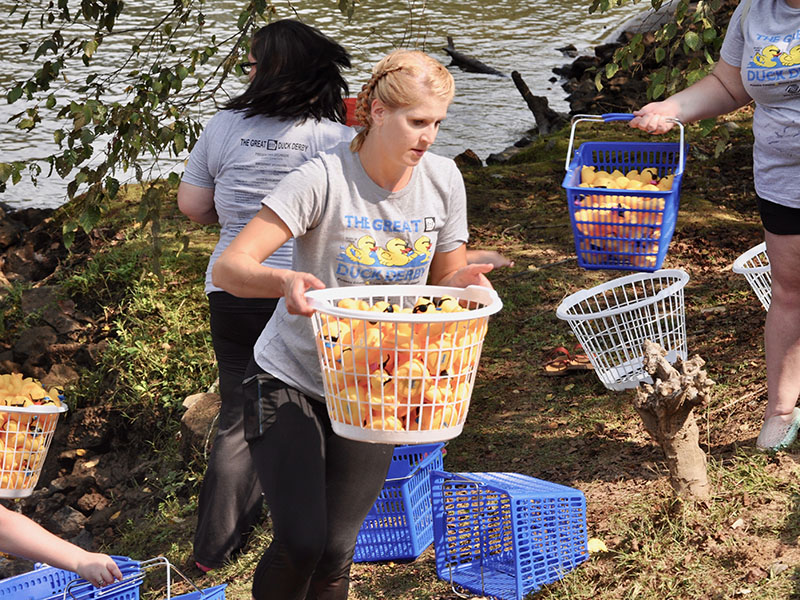 Brittany Byess helped the Boys & Girls Clubs of North Georgia collect rubber ducks from the Toccoa River at the conclusion of the annual Great 515 Duck Derby at Ron Henry Horseshoe Bend Park.