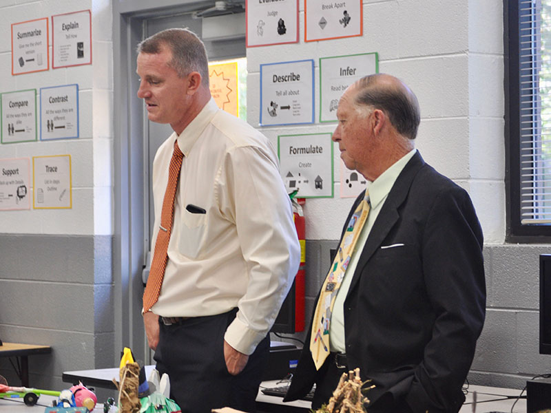 Fannin County Board of Education members Chad Galloway, left, and Bobby Bearden walk through the STEM classroom at Fannin County Middle School to view student projects during the board retreat Thursday, October 10.