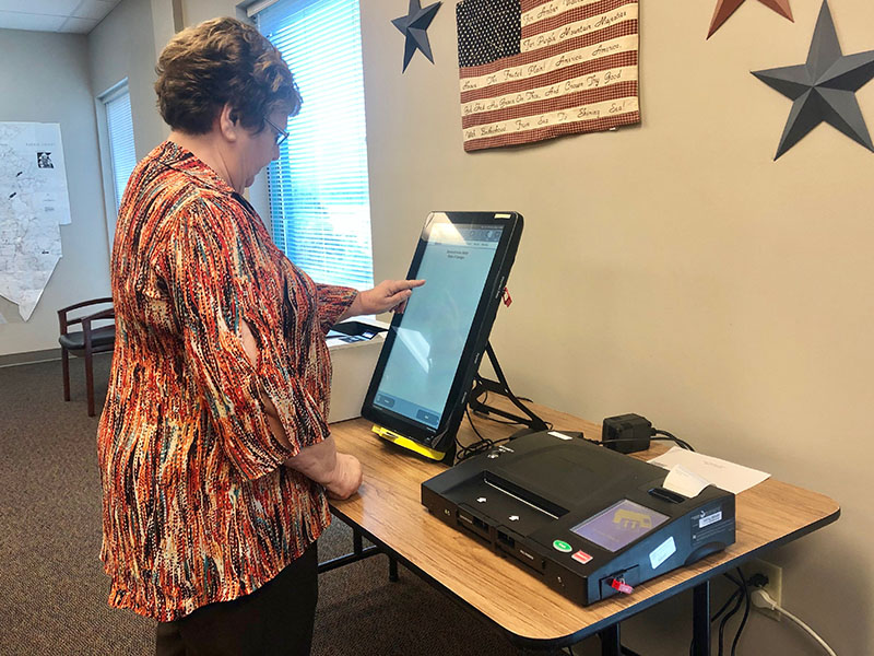 Fannin County Election Supervisor Mary Ann Conner tests one of Georgia’s new voting machines. The Board of Elections office invites Fannin County citizens to try out the machine before the next election.