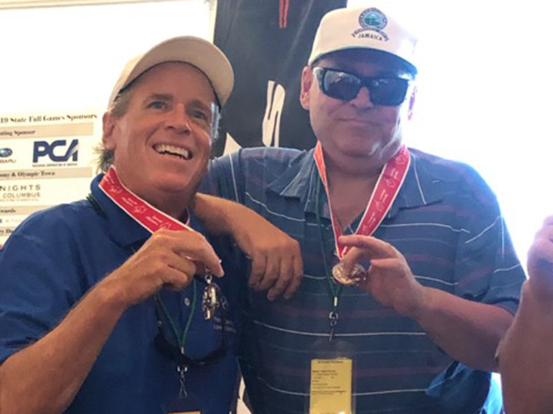 Special Olympics athlete Kevin Turner was able to win the silver medal in the unified State Golf Tournament at Valdosta, Georgia, Saturday, October 12. Turner, right, is shown with his partner Craig Hartman as they show their silver medals.