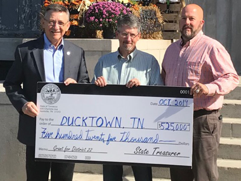 Tennessee State Representative Dan Howell, left, presented a $525,000 check for a Community Development Block Grant to Ducktown Mayor Doug Collins, center, and Polk County Executive Robby Hatcher. The money will be used to make badly needed repairs to the main water line leading from the city’s water tower, Howell said. The presentation was made in Benton Monday, October 28.
