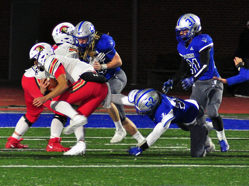 Fannin Rebels Jackson Weeks (54), Micah O’Neal (52) and Campbell Cosentino (31) swarm towards the ball carrier during the Rebels region match with GAC Friday, November 8.
