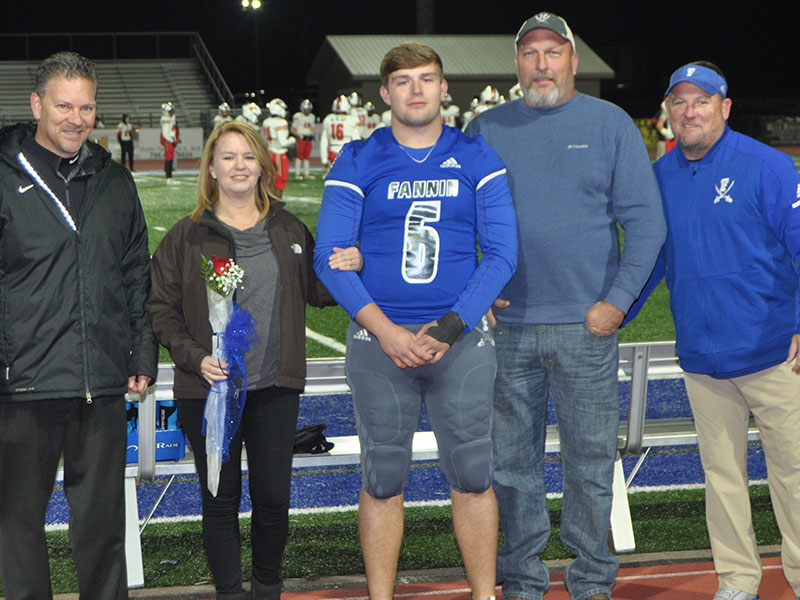 FCHS senior Jakob Tuggle was honored before the Rebels played Greater Atlanta Christian Friday, November 8. Tuggle is shown with his parents Sandi and David Tuggle.