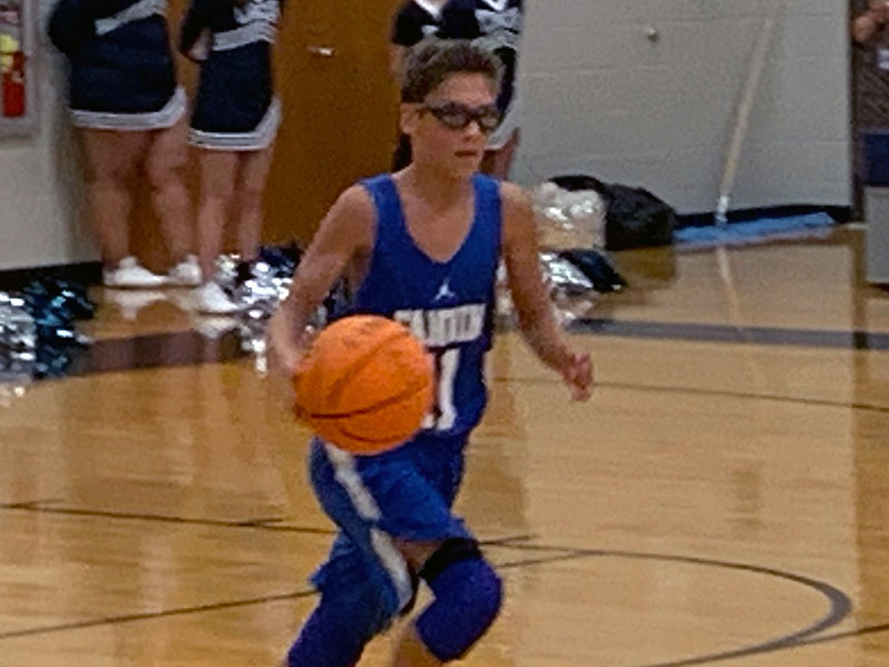 Eighth grader Benjamin Bloch brings the ball up the court during the Rebels game with White County Thirsday, November 7.