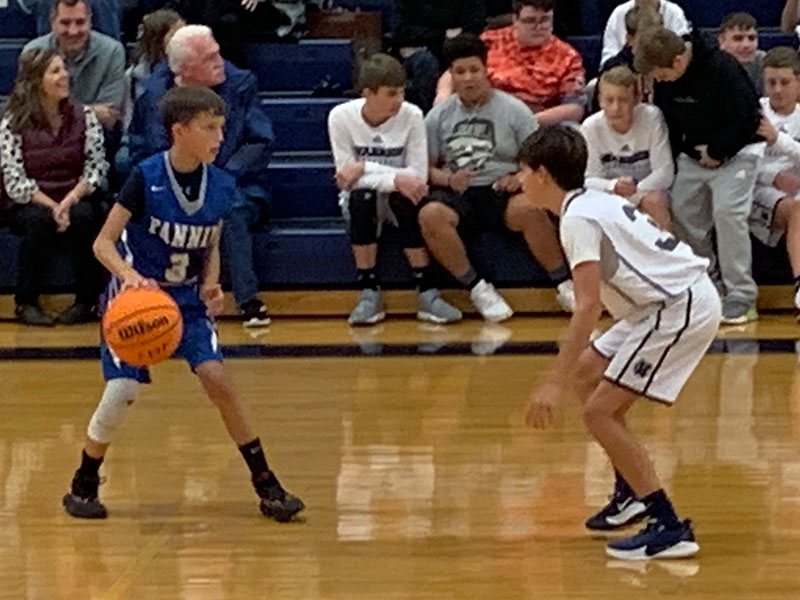 Seventh grader Matthew Ponton handles the defensive pressure from White county during the Rebels basketball game Thursday, November 7.