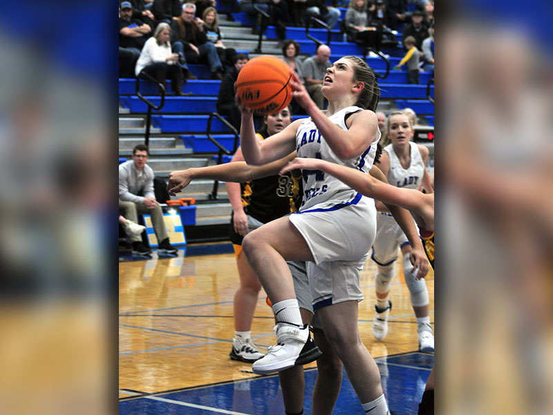 Lady Rebel Abby Ledford fights through the Murphy defenders during the Lady Rebels basketball scrimmage with the Lady Bulldogs Thursday, November 14.
