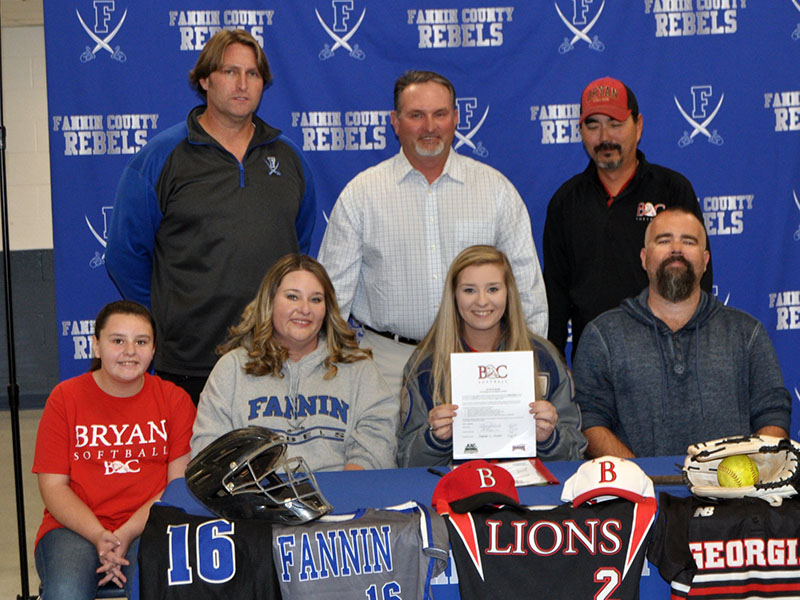 Senior Lady Rebel softball player Kayleigh Russell signed a scholarship to further her athletic and academic career at Bryan College in Dayton, Tennessee. Shown following the ceremony are, from left, front, Kelsey Russell, sister; Tina Russell, mother; Kayleigh Russell, Justin Russell, father; and back, FCHS head softball coach Alan Collis, travel ball coach Steve Young and Bryan College assistant softball coach Pete Massengale.