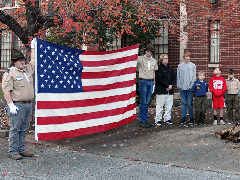 Ducktown Boy Scout Troop 14 and Cub Scout Pack 3014 held a flag retirement ceremony at the old Ducktown School, November 9. Shown are, from left, Assistant Scout Master of Troop 14 Jonothon Payne, Dakota Harris, Jeremiah Hill, Christian Setser, Kegan Patterson, Jasper Mealer and Judson Allen.