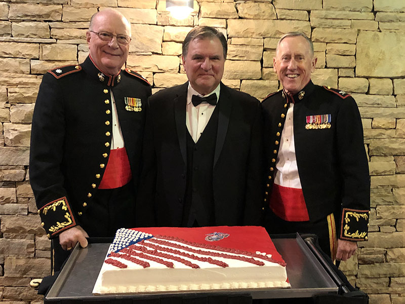 Lieutenant Colonel Dale Greene, Judge Patrick Murphy and Colonel Mike Nunnally, shown from left, stand together with the ceremonial cake celebrating the 244th Birthday Celebration of the United States Marine Corps. The Ball is the 5th Annual U.S. Marine Corps Birthday Ball put on by the Marine Corps League, Lake Blue Ridge Detachment #1438.