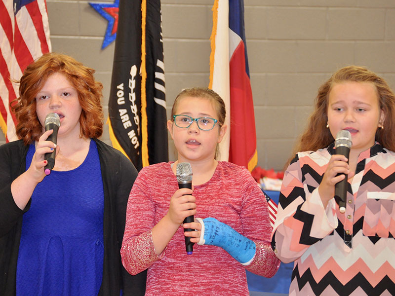 Blue Ridge Elementary School students sang the Star Spangled Banner during the school’s Veterans Day Ceremony Friday, November 8. Shown are, from left, Mya Hill, Tatum Ledford and Cassidy Walden.