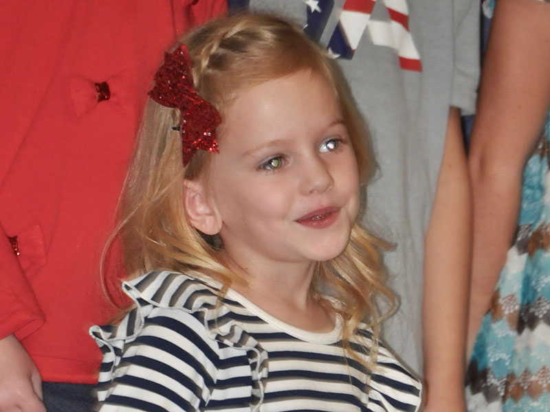 Paisley Patton danced as she sang along with her classmates at East Fannin Elementary School’s veterans program.