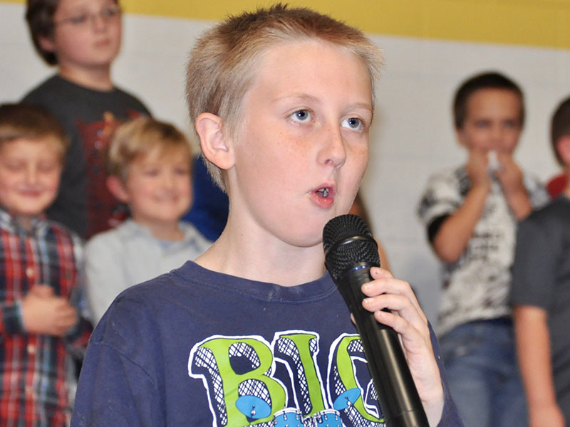 Isaiah Garland spoke before joining his classmates to sing a patriotic tune during East Fannin Elementary School’s veterans day program Wednesday, November 6.