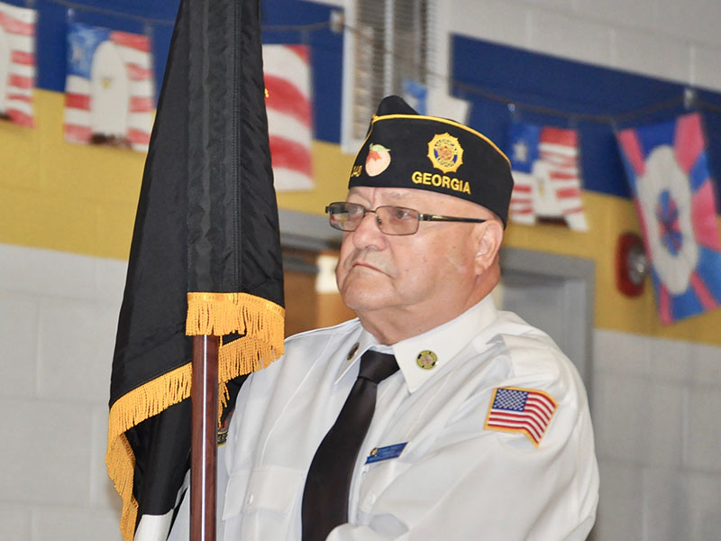 American Legion Post 248 Commander Richard Crosley carried the Missing in Action/Prisoner of War (POW/MIA) flag during East Fannin Elementary School’s veterans program.