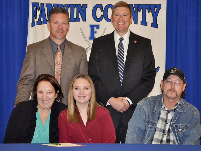 Fannin County Middle School student Amy Truett signed her REACH scholar contract with her family Tuesday, November 12. Shown are, from left, front, Amanda Little, Amy Truett and Brandon Truett; back, Fannin County High School Principal Erik Cioffi and Superintendent Dr. Michael Gwatney.