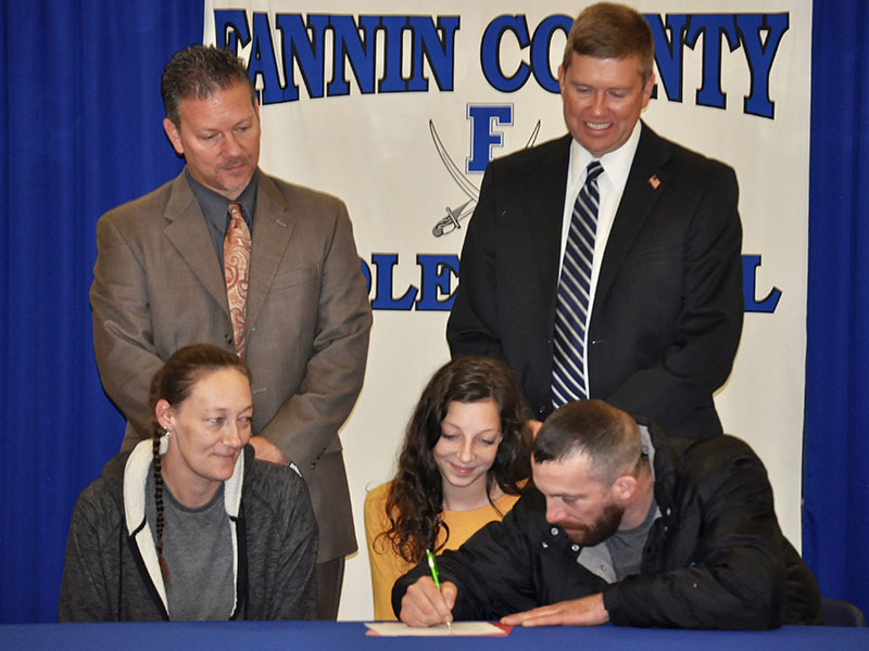 Fannin County Middle School student Chelsey Thomas’ parents agreed to support her as a REACH scholar during the signing ceremony. Shown are, from left, front, Beth Thomas, Chelsey Thomas and Phillip Thomas; back, Fannin County High School Principal Erik Cioffi and Superintendent Dr. Michael Gwatney.