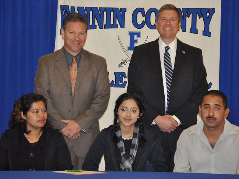 Fannin County Middle School student Brisa Lopez-Garcia signed her REACH scholar contract with her family Tuesday, November 12. Shown are, from left, front, Silvia Garcia, Lopez-Garcia and Martin Lopez; back, Fannin County High School Principal Erik Cioffi and Superintendent Dr. Michael Gwatney.