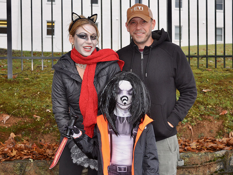 The rain didn’t stop people from trick-or-treating at the Blue Ridge Safe Zone event. Shown are, from left, Jessica Parris, Shawn Parris and Bryan Denahee.