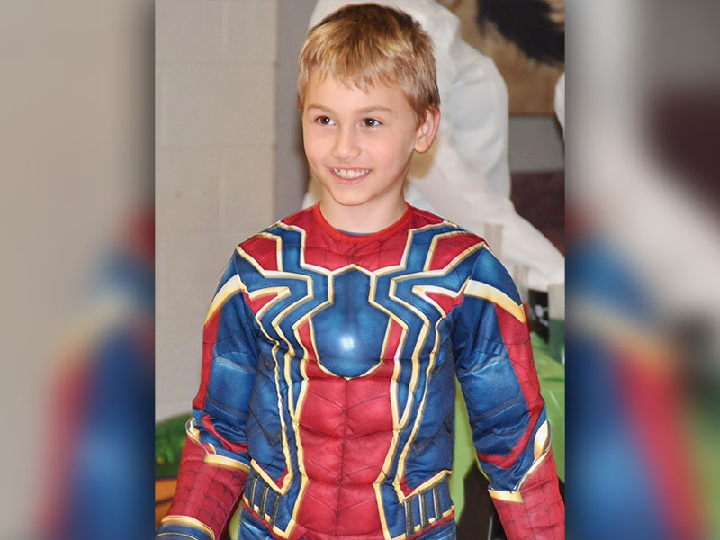 Spiderman reveals his secret identity, which is none other than West Fannin Elementary School student Connor Owens, at the school’s trick-or-treating event Thursday, October 31.