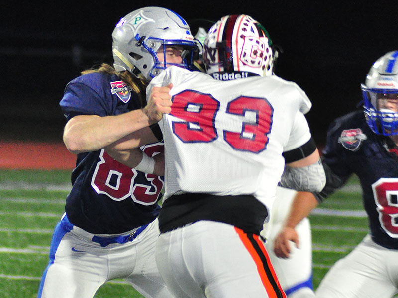 Fannin Rebel Jackson Weeks protects the quarterback during the Fellowship of Christian Athletes Border War at Fannin County High School Thursday, December 19.