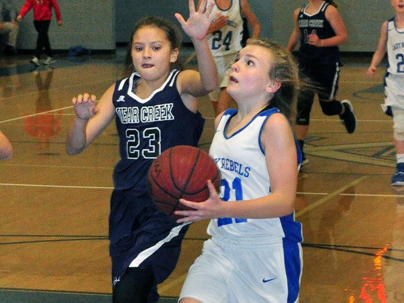 Seventh grade Lady Rebel Maddie Ledford goes up for a layup in recent action for Fannin County Middle School.