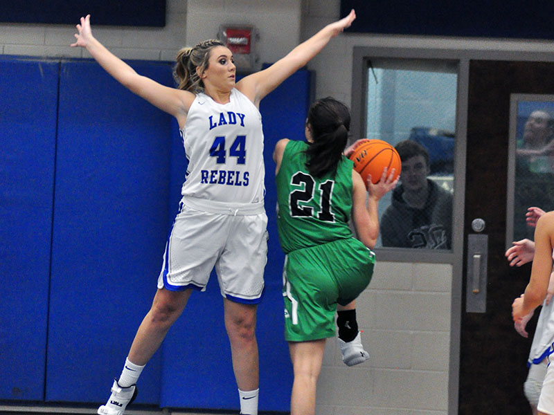 Lady Rebel Olivia Sisson goes up for a block in recent action for Fannin County High School.